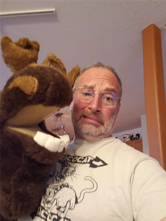 DragonsTales creator Eric Lizotte with a plush moose puppet